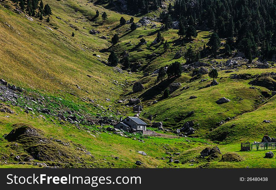 Image of a shelter located in a mountainous valley (Ossau Valley) in Pyrenees Mountains, France.