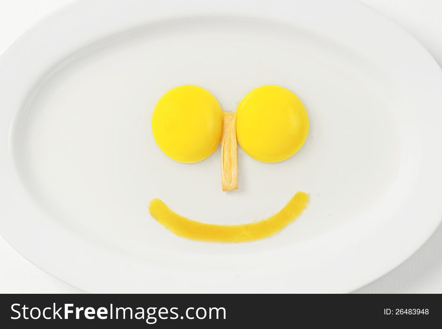 Images 2 pieces large egg yolk derived from a single egg. its shape resembles a smile faces. Images 2 pieces large egg yolk derived from a single egg. its shape resembles a smile faces.