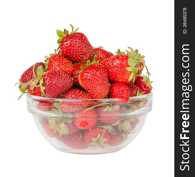 Strawberries in the deep transparent plate on the white