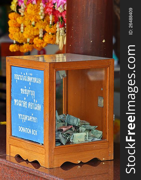 Donation Box with Thai Baht banknote