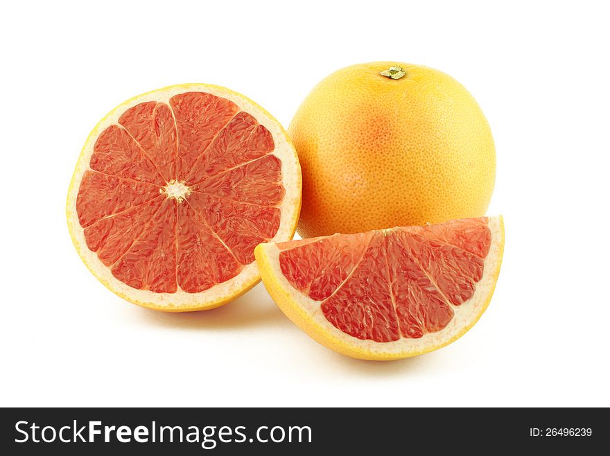 Grapefruit, half and slice on white background