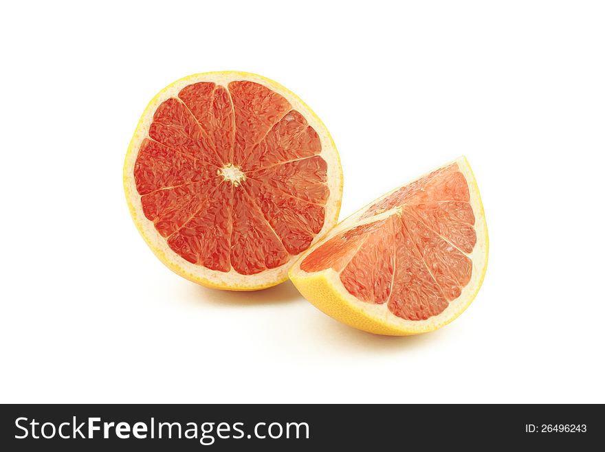 Half and slice of grapefruit on white background
