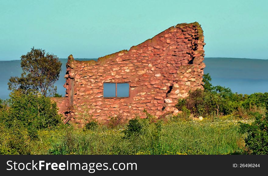 Landscape with ruin of a red stone farm house. Landscape with ruin of a red stone farm house