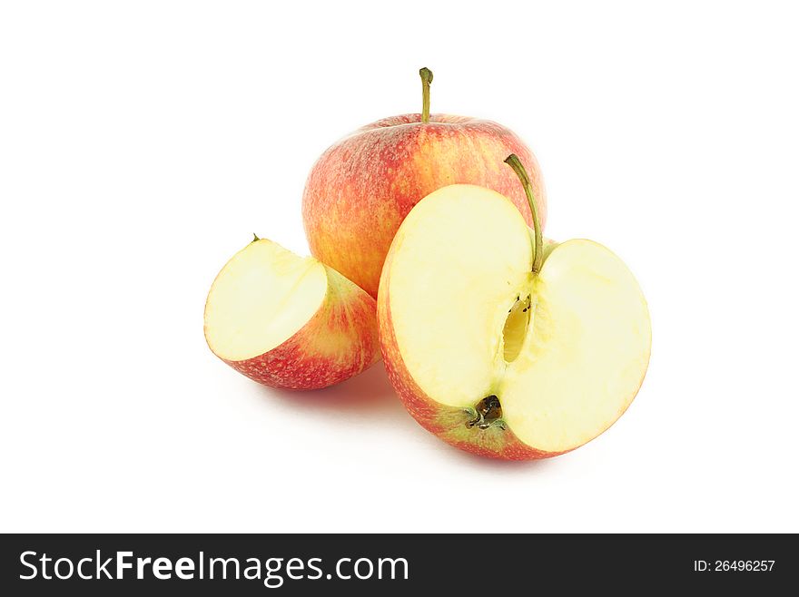 Red apple, half and a slice on white background