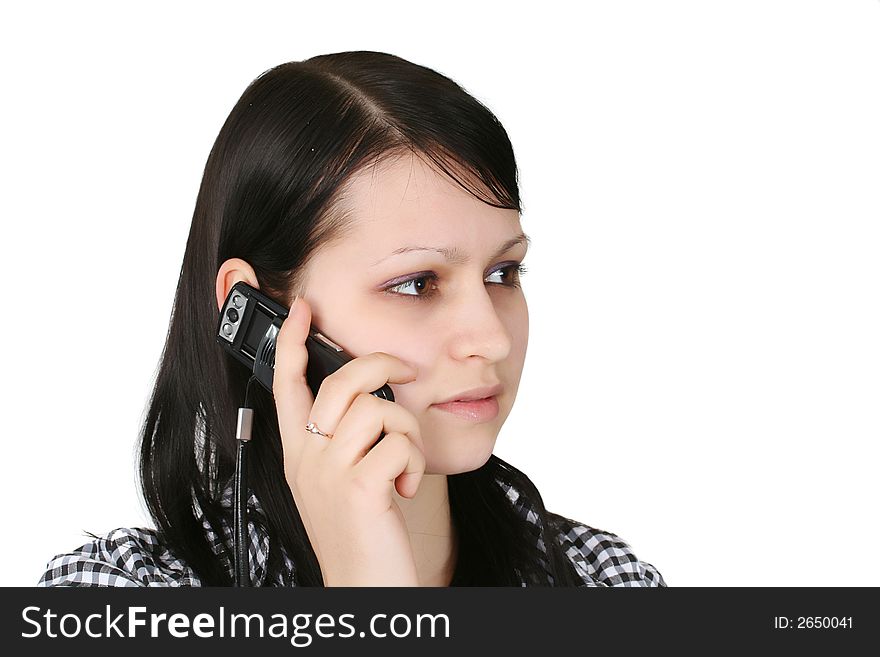 The young business woman speaks by phone. The young business woman speaks by phone