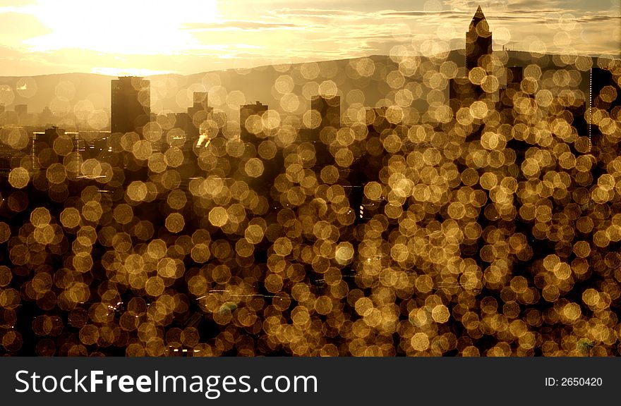 Rain drops on window looking at Frankfurt Skyline during sunset. Rain drops produce beautiful crystals. Rain drops on window looking at Frankfurt Skyline during sunset. Rain drops produce beautiful crystals