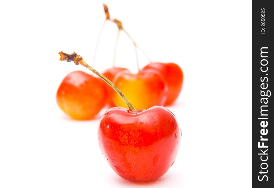 Fresh cherries isolated over white background