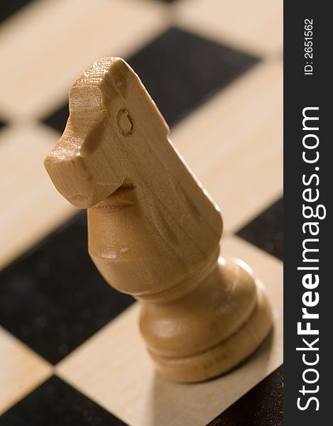 A Chess board and piece close up