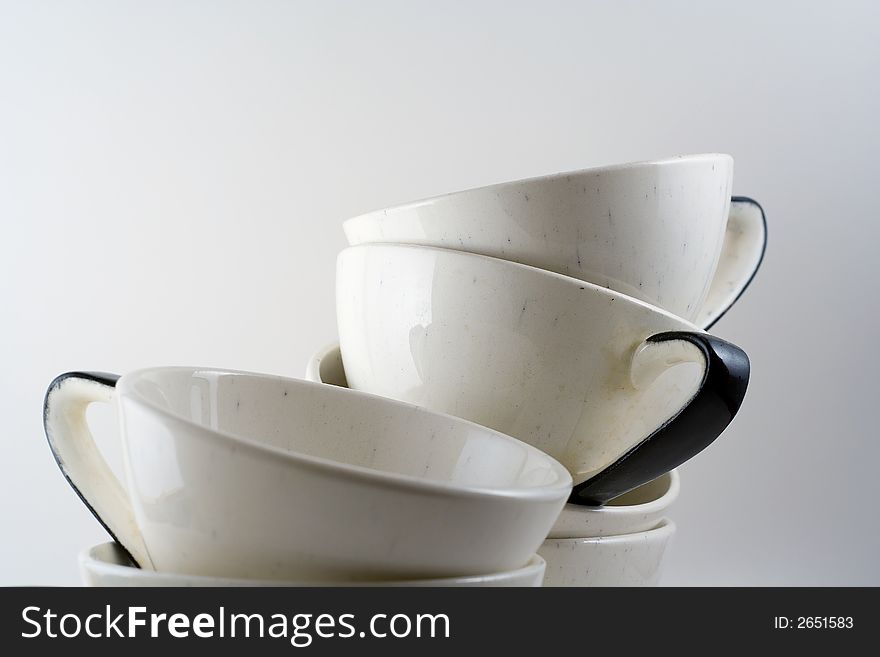 Antique tea cups with black speckles