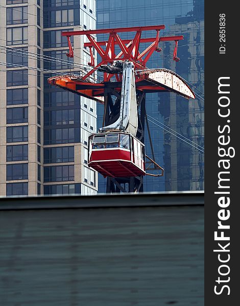 Close up of a red cable car against city Sky Scrapers. Close up of a red cable car against city Sky Scrapers