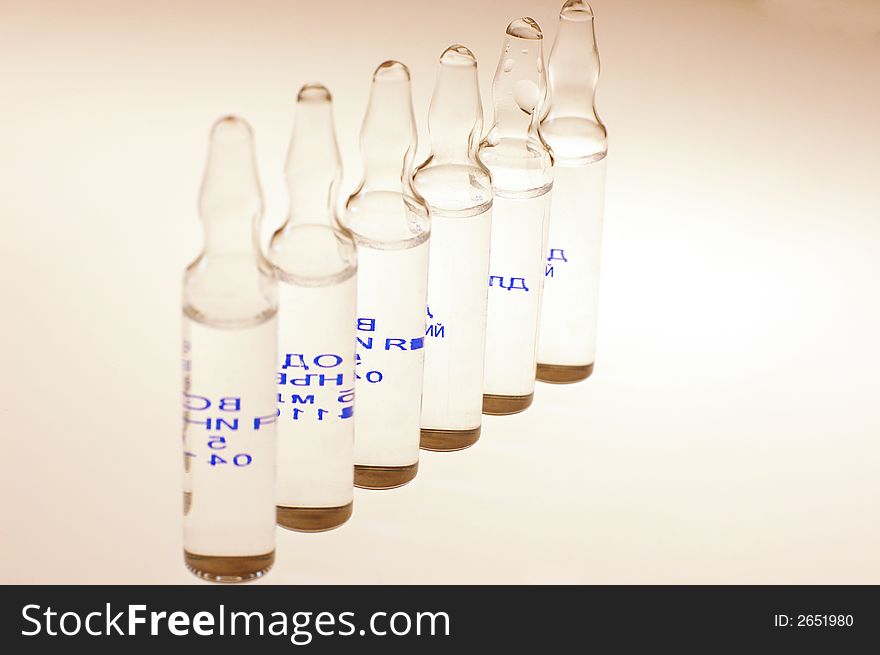 Medication ampoules standing in a row