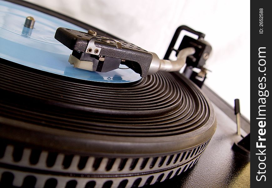 Gramophone with blue record on it.