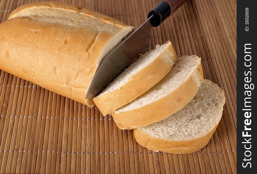 A loaf of French Bread on a place mat