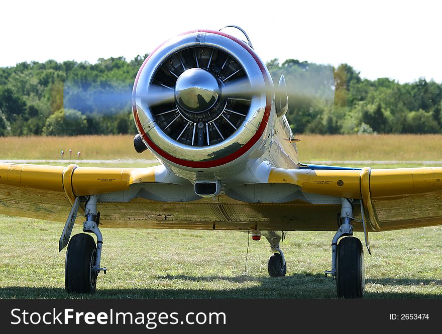 An old airplane displayed in field