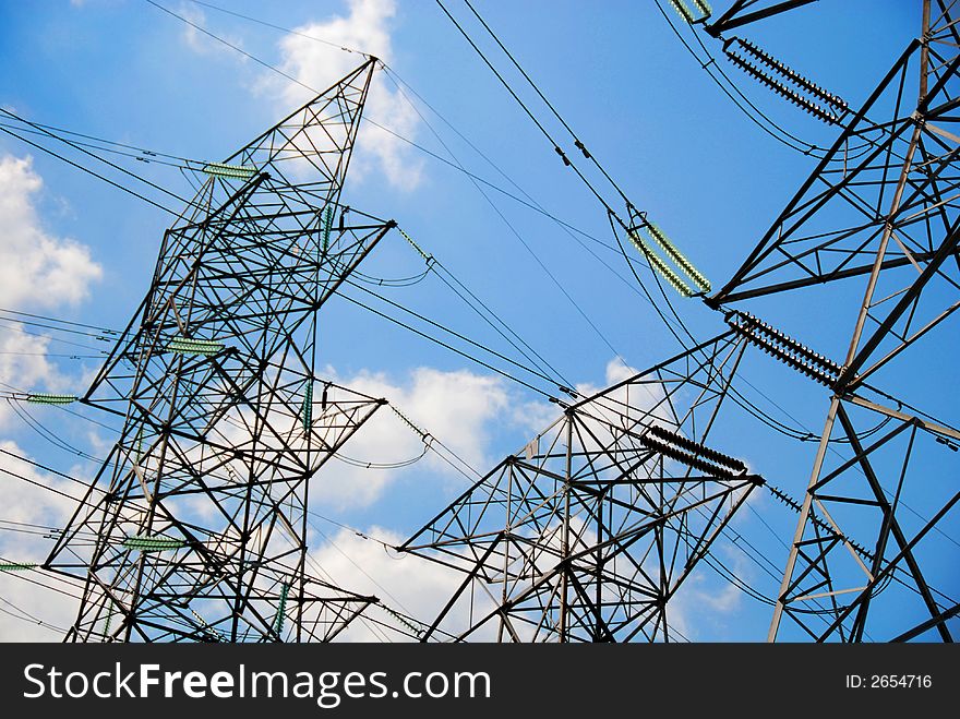 A group of high voltage tower in the blue sky. A group of high voltage tower in the blue sky
