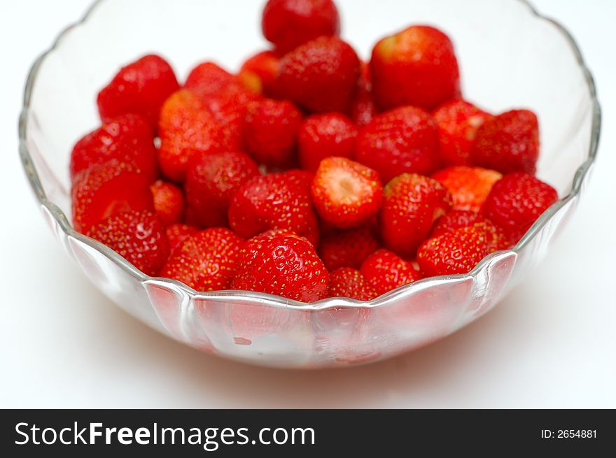 Glass bowl of fresh red strawberries. Glass bowl of fresh red strawberries.