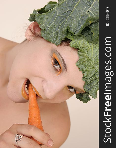 Girl with carrot and savoy cabbage hat