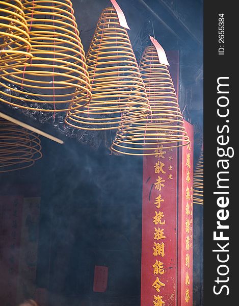 Hanging incense coils burning in a temple in Hong Kong