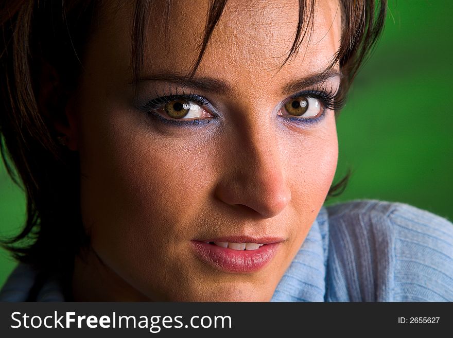 Close-up of a beautiful brunette with green eyes