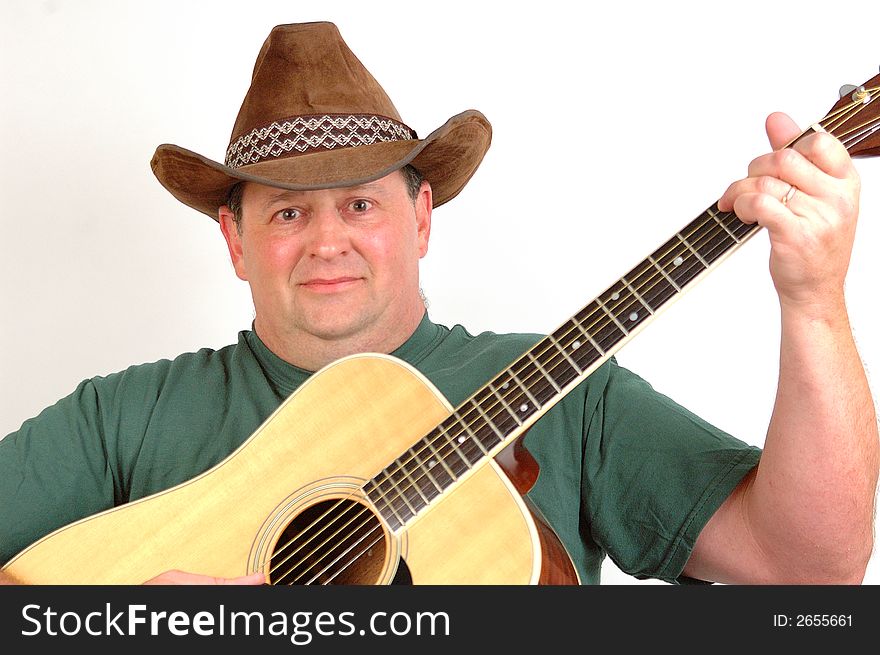 Man playing the guitar and singing for family and friends. Man playing the guitar and singing for family and friends.