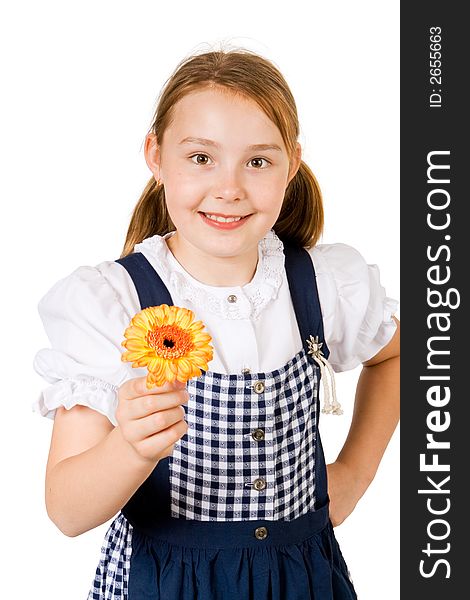 A pretty girl in a blue and white dress holding a yellow flower