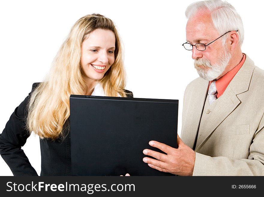 Two business associates looking at a laptop. Two business associates looking at a laptop