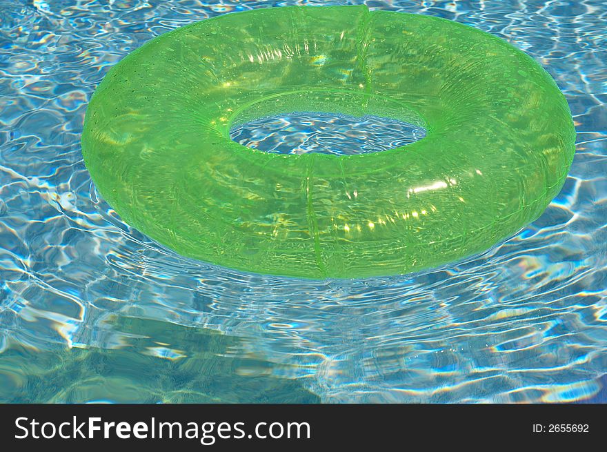 Round float in pool of water. Round float in pool of water