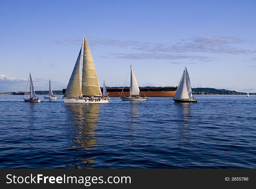 Sailboats on Elliott Bay in downtown Seattle, WA. Sailboats on Elliott Bay in downtown Seattle, WA