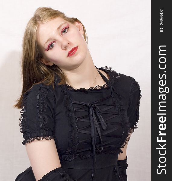 An attractive young lady in black lacy dress. An attractive young lady in black lacy dress