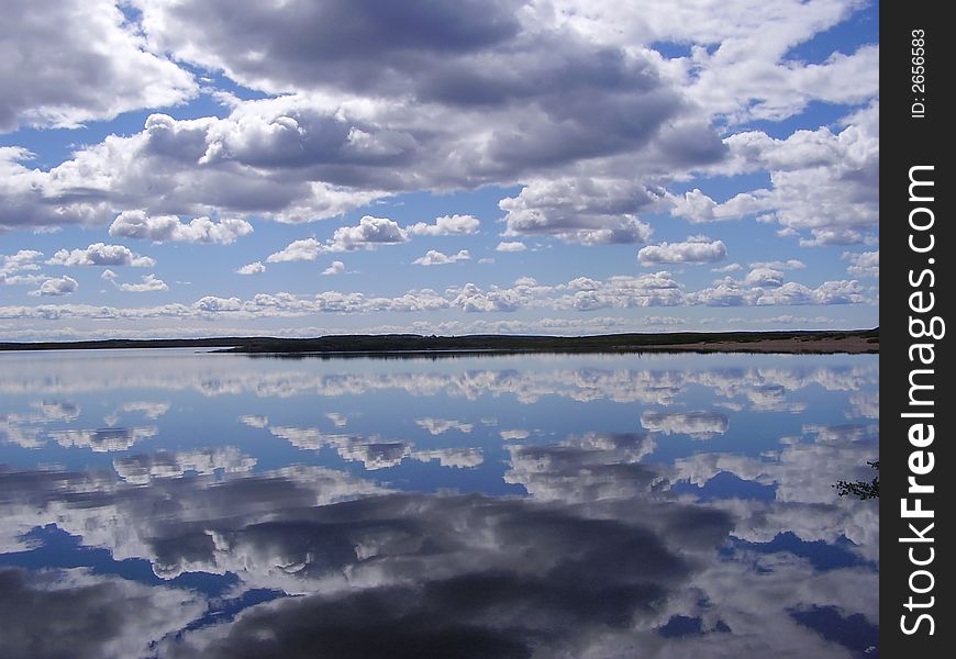 Clouds reflected off the calm lake. Clouds reflected off the calm lake.