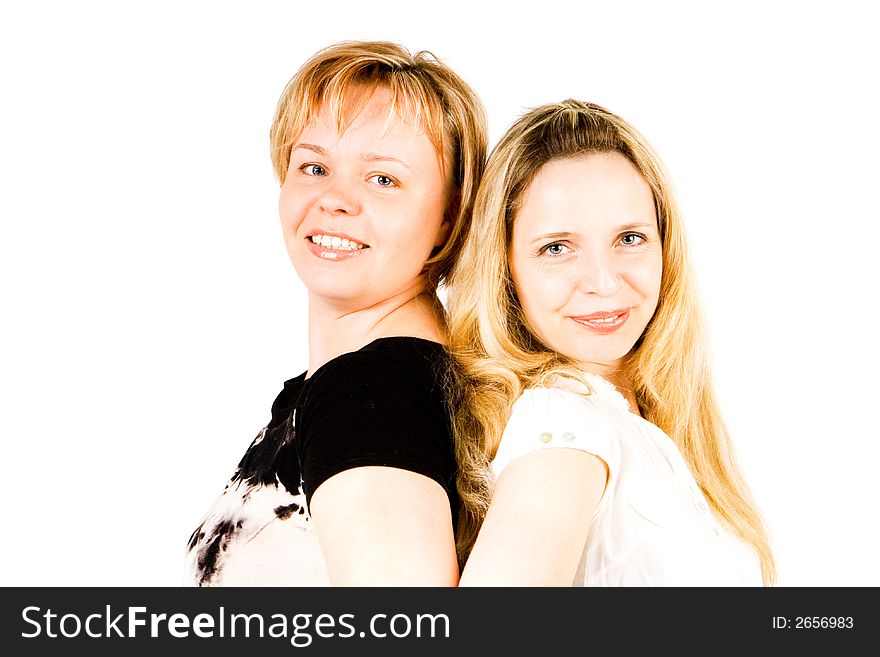 Two sisters back to back with a white background