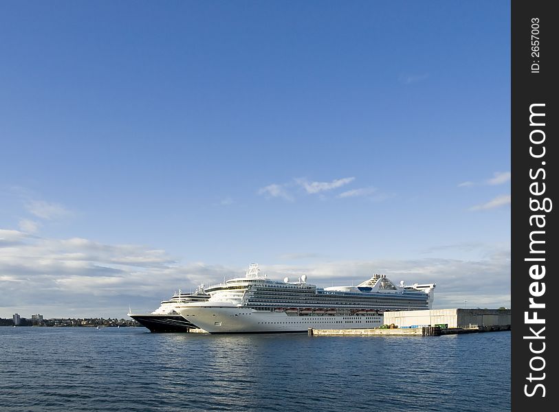 Two luxury cruise ships docked at a stopover point. Two luxury cruise ships docked at a stopover point