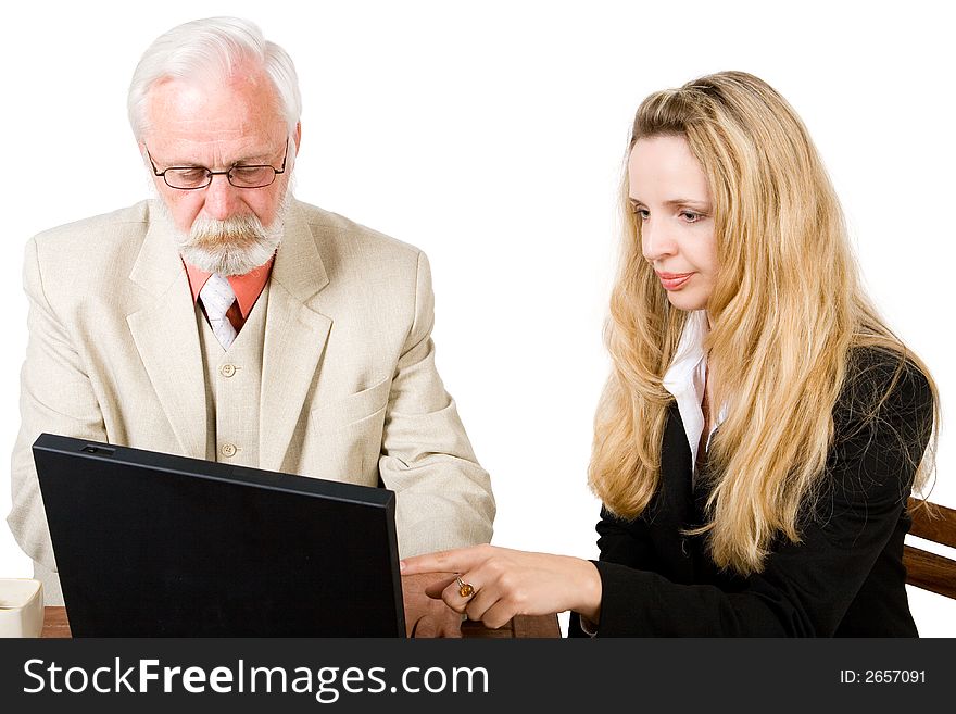 A business team looking at a laptop (2). A business team looking at a laptop (2)