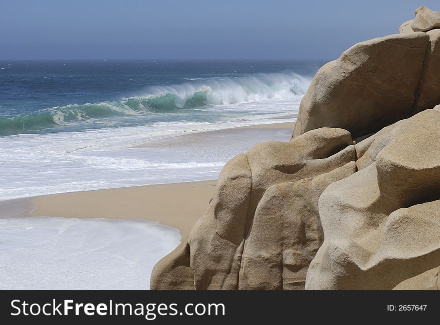 Rock formations sculpted by waves on Lovers' beach in Cabo San Lucas, Mexico.