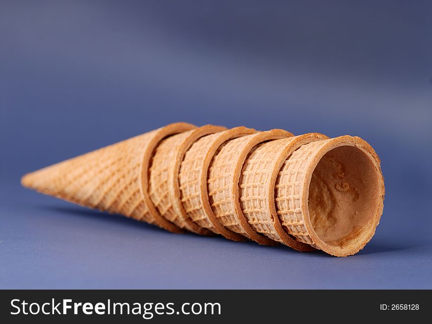 Several waffle cones laying on their sides