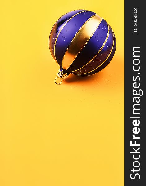 Dark blue color New Year's ball on  yellow background