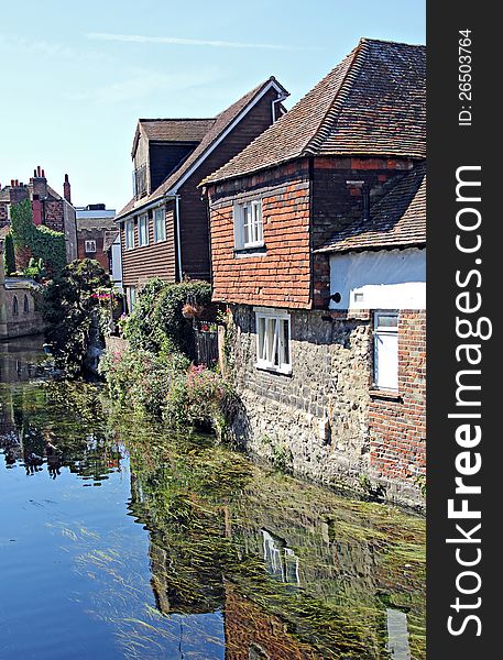 Picturesque photo of riverside cottages in the historic city of canterbury kent england.