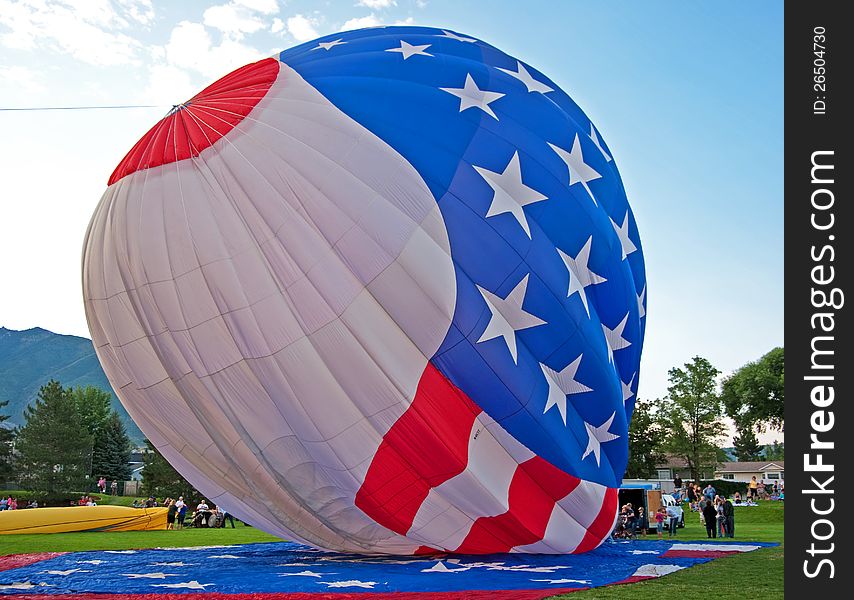 American flad hot air balloon facing a storm. American flad hot air balloon facing a storm