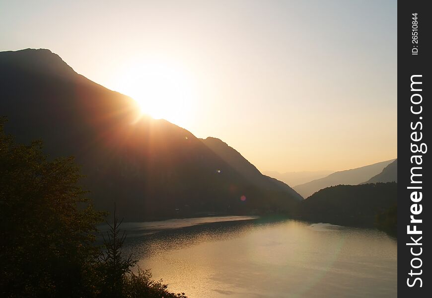 A view on a sunrise at Lago di Ledro, Italy. A view on a sunrise at Lago di Ledro, Italy