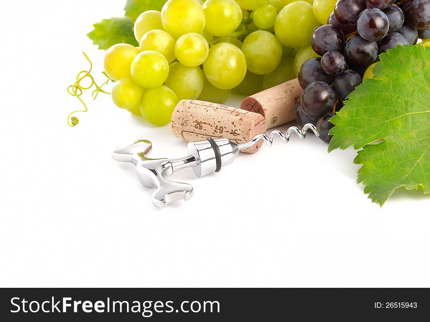 Grapes, corks and corkscrew over white. Grapes, corks and corkscrew over white