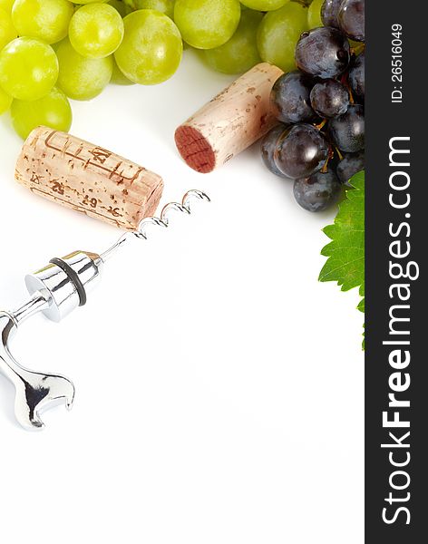 Grapes, corks and corkscrew over white. Grapes, corks and corkscrew over white