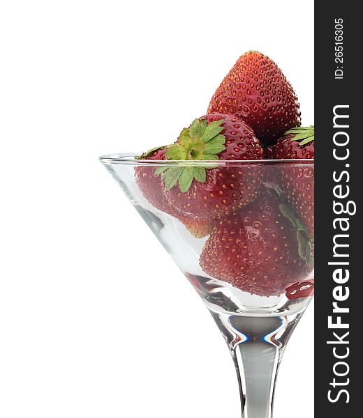 Strawberry in a glass on a white background. Strawberry in a glass on a white background