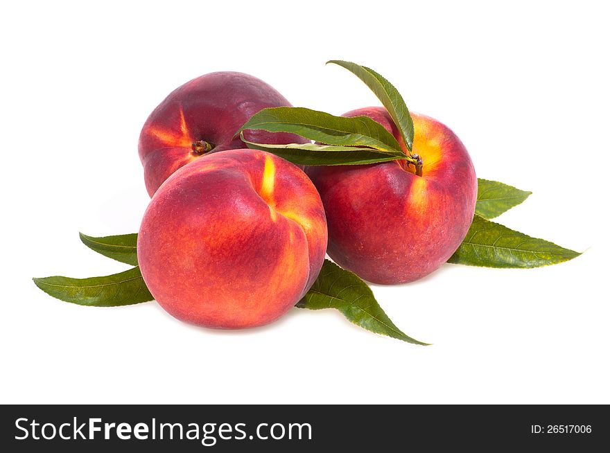 Three peaches slistvy on a white background