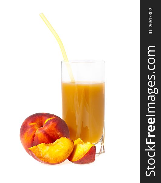 Peach juice in a glass nearby a peach from shares