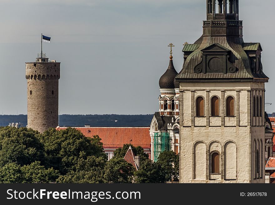 St. Nicholas' Church, Alexander Nevsky Cathedral and Tall Hermann tower of the Toompea Castle with Estonia national flag. St. Nicholas' Church, Alexander Nevsky Cathedral and Tall Hermann tower of the Toompea Castle with Estonia national flag