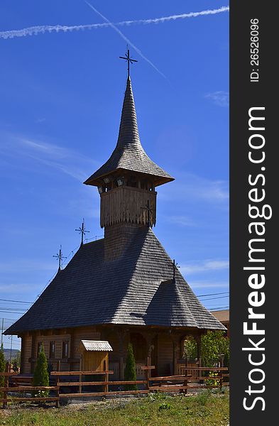Traditional Transylvanian wooden church, in a rural setting, south of Cluj, Romania