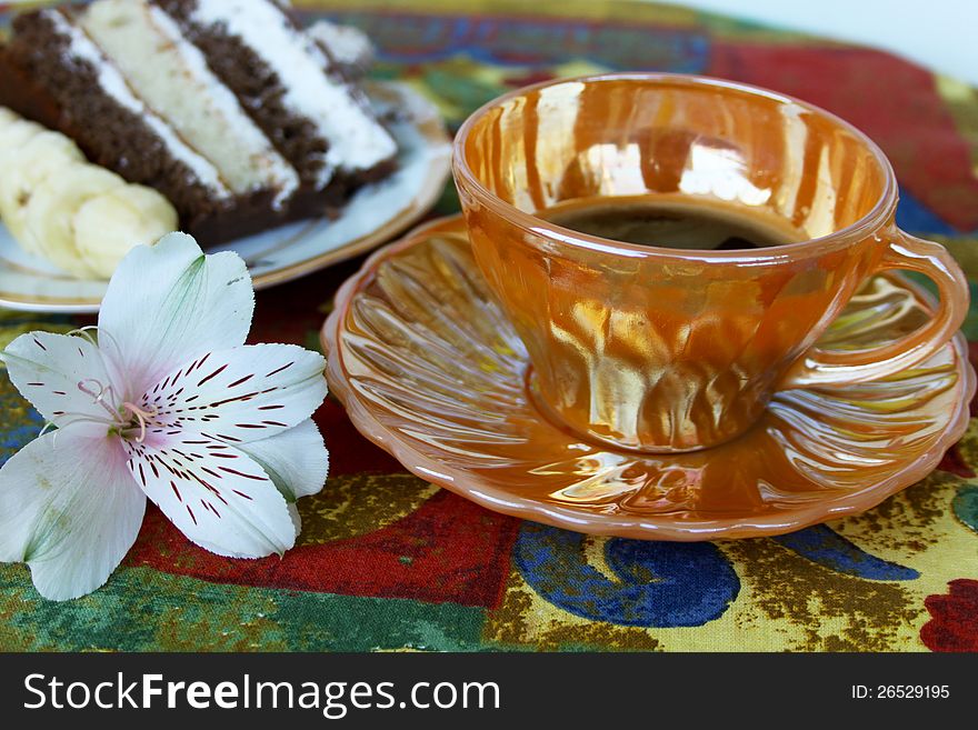 Cup of coffee with cake on colorful cloth. Cup of coffee with cake on colorful cloth