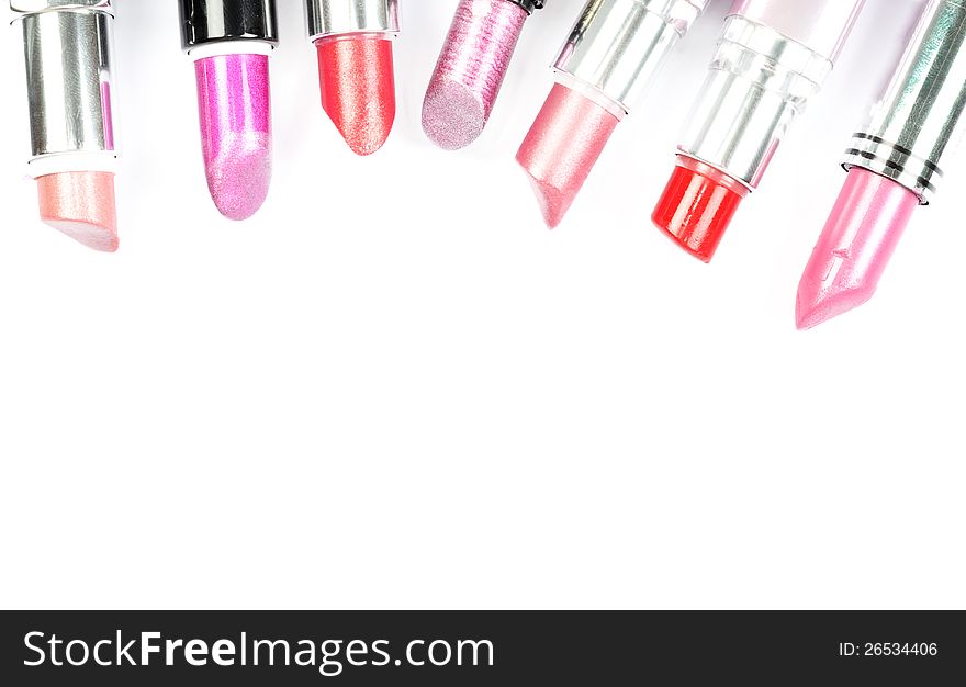 Collection of various lipstick on a white background. Collection of various lipstick on a white background