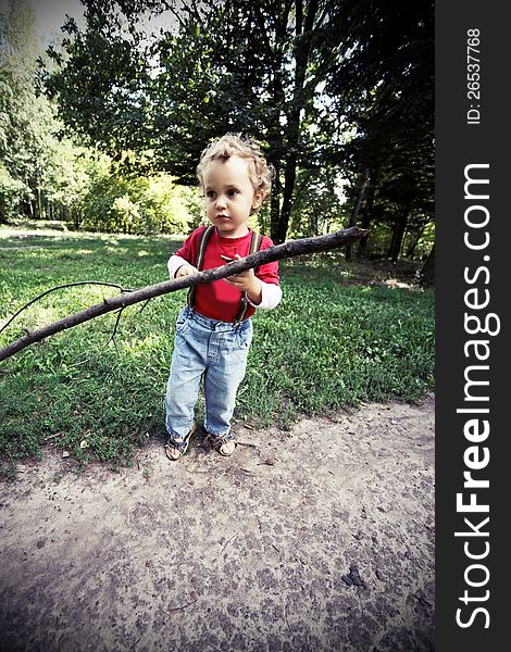 Frightened boy walks in the woods in the spring