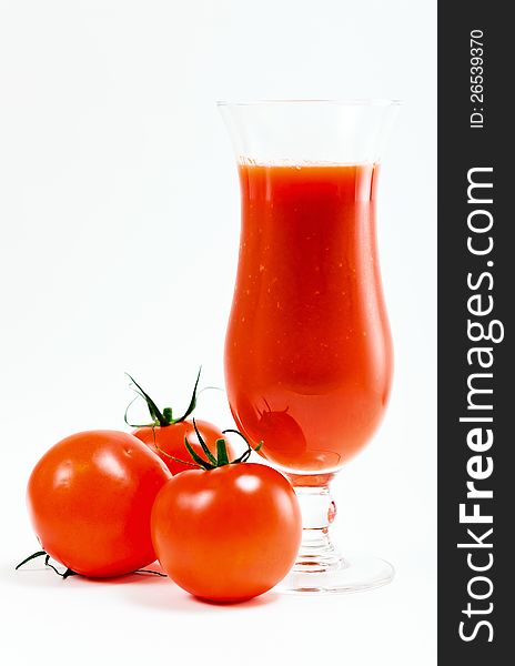 Tomatoes and tomato juice on a white background.